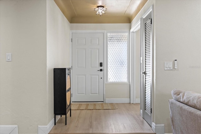 6875 11th Ave N, Saint Petersburg, FL 33710 - entryway featuring light wood finished floors and baseboards