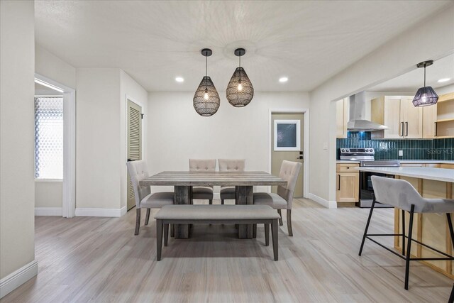 6875 11th Ave N, Saint Petersburg, FL 33710 - dining room featuring light wood finished floors, baseboards, and recessed lighting