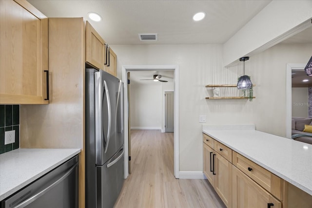 6875 11th Ave N, Saint Petersburg, FL 33710 - kitchen with stainless steel appliances, light wood-style floors, ceiling fan, light countertops, and recessed lighting
