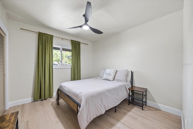 6875 11th Ave N, Saint Petersburg, FL 33710 - bedroom with light wood-style floors, baseboards, and a ceiling fan