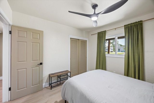 6875 11th Ave N, Saint Petersburg, FL 33710 - bedroom with light wood-type flooring, a closet, and ceiling fan