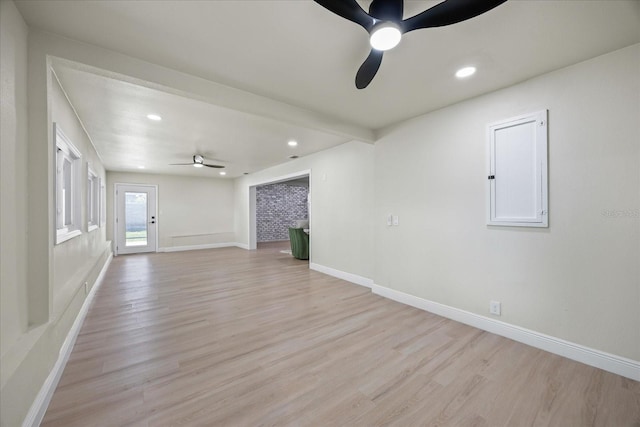 6875 11th Ave N, Saint Petersburg, FL 33710 - unfurnished living room featuring ceiling fan, light wood finished floors, recessed lighting, and baseboards