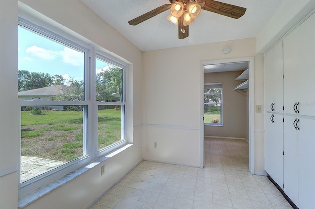 3053 Gregor Ct, Palm Harbor, FL 34684 - spare room with baseboards, a ceiling fan, and a smoke detector