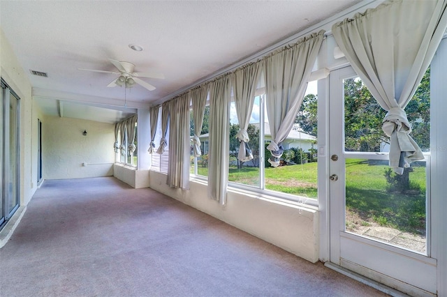 3053 Gregor Ct, Palm Harbor, FL 34684 - unfurnished sunroom featuring a ceiling fan and carpet floors