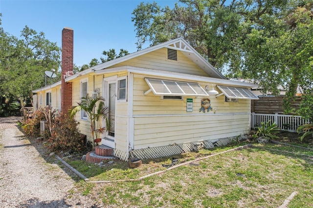 2245 Bahia Vista St, Sarasota, FL 34239 - view of home's exterior with a chimney