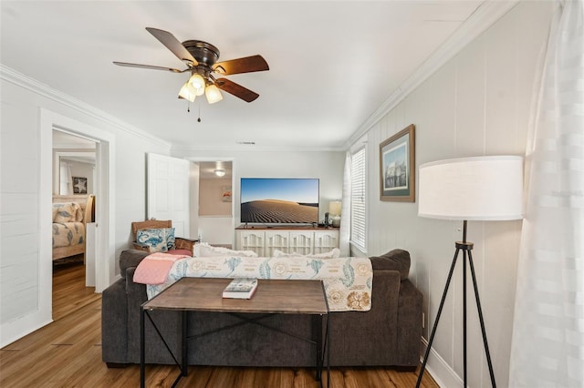 2245 Bahia Vista St, Sarasota, FL 34239 - living area with wood finished floors, crown molding, and ceiling fan