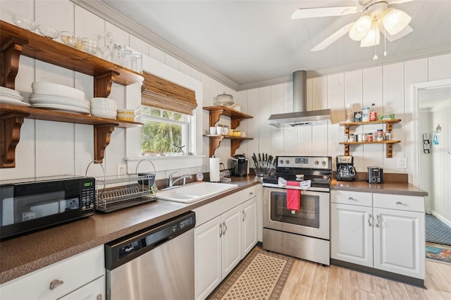 2245 Bahia Vista St, Sarasota, FL 34239 - kitchen with open shelves, stainless steel appliances, wall chimney range hood, a sink, and dark countertops