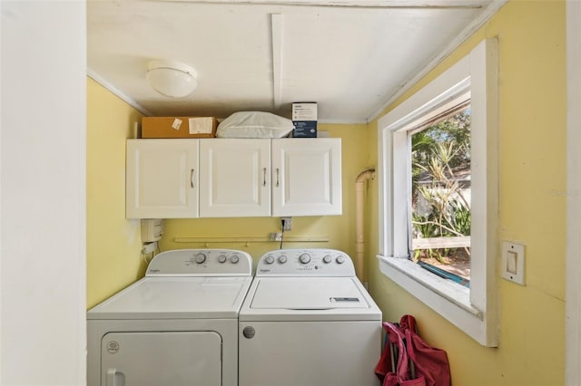 2245 Bahia Vista St, Sarasota, FL 34239 - laundry area featuring cabinet space, washing machine and clothes dryer, and crown molding