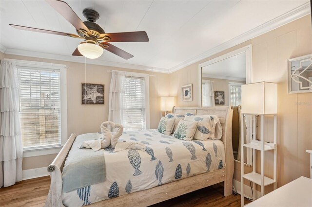 2245 Bahia Vista St, Sarasota, FL 34239 - bedroom featuring ornamental molding, wood finished floors, multiple windows, and ceiling fan