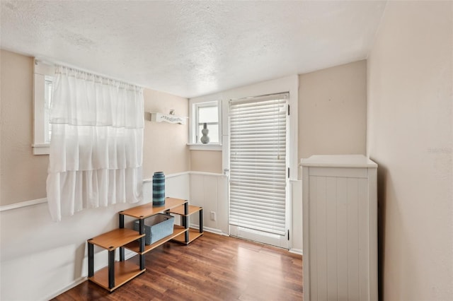 2245 Bahia Vista St, Sarasota, FL 34239 - bedroom with a textured ceiling, wood finished floors, and baseboards