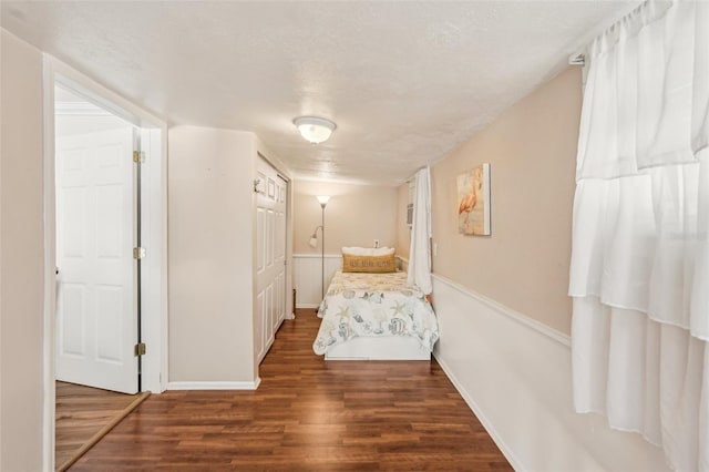 2245 Bahia Vista St, Sarasota, FL 34239 - bedroom with wood finished floors, baseboards, and a textured ceiling