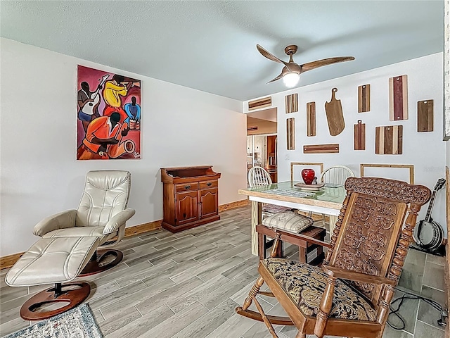 602 Mindy Dr, Largo, FL 33771 - dining area featuring light wood-type flooring, a ceiling fan, and baseboards