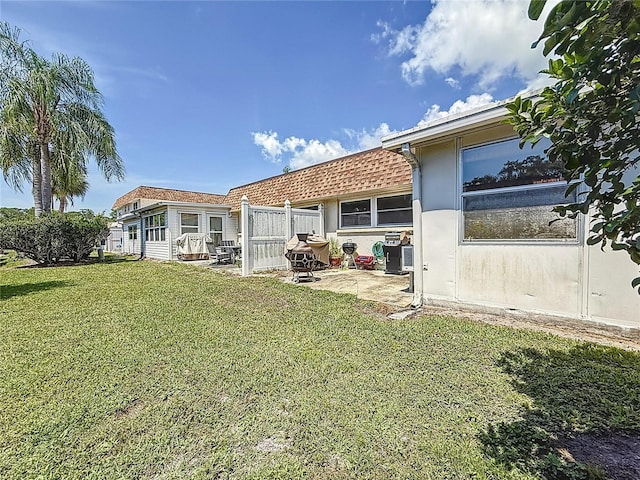 602 Mindy Dr, Largo, FL 33771 - view of green lawn with a patio area