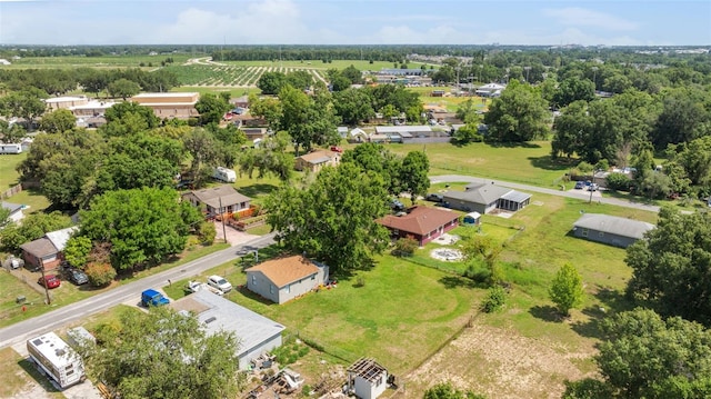 aerial view of sparsely populated area featuring nearby suburban area