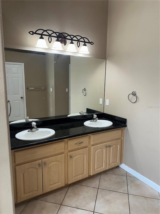 13632 Deventer Ct, Hudson, FL 34667 - full bath featuring tile patterned floors, double vanity, and baseboards