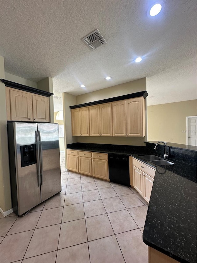 13632 Deventer Ct, Hudson, FL 34667 - kitchen with stainless steel fridge, black dishwasher, light brown cabinets, a sink, and a peninsula