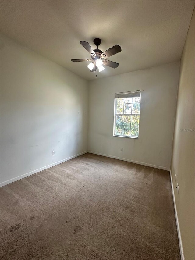 13632 Deventer Ct, Hudson, FL 34667 - carpeted empty room featuring baseboards and a ceiling fan