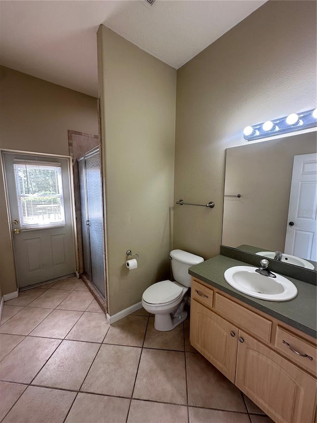13632 Deventer Ct, Hudson, FL 34667 - bathroom with a stall shower, tile patterned flooring, vanity, toilet, and baseboards