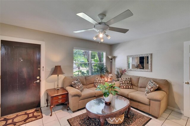 3626 S Hesperides St, Tampa, FL 33629 - living room with light tile patterned floors, a ceiling fan, and baseboards
