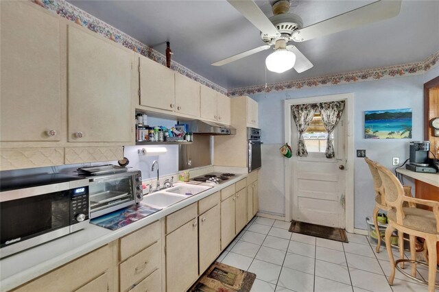 3626 S Hesperides St, Tampa, FL 33629 - kitchen with wall oven, stainless steel microwave, a sink, and light countertops