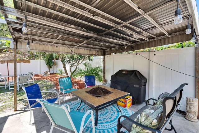 3626 S Hesperides St, Tampa, FL 33629 - fenced backyard featuring area for grilling, a patio, and a fire pit