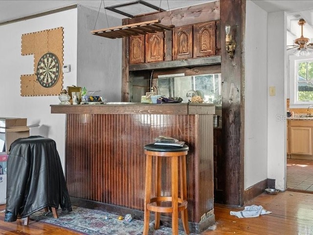 485 E Stanford St, Bartow, FL 33830 - indoor dry bar with hardwood / wood-style flooring, a ceiling fan, and baseboards