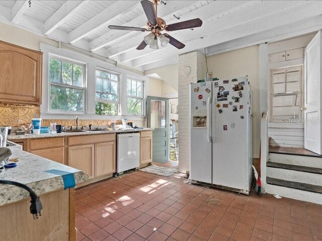 485 E Stanford St, Bartow, FL 33830 - kitchen featuring white appliances, light brown cabinetry, light countertops, beam ceiling, and backsplash