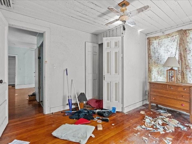 485 E Stanford St, Bartow, FL 33830 - bedroom with wood-type flooring, wooden ceiling, and a textured wall