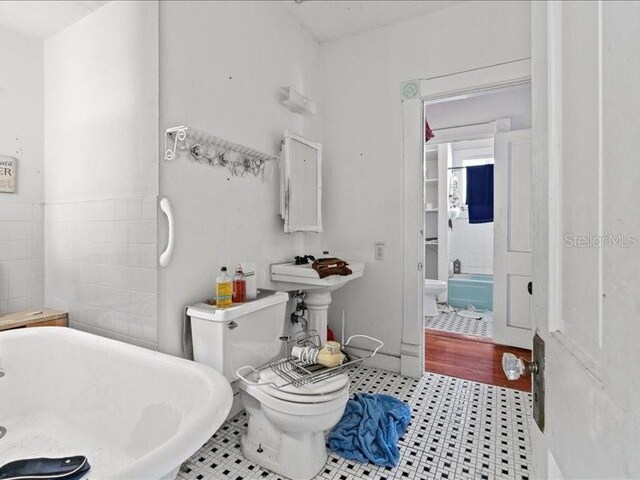 485 E Stanford St, Bartow, FL 33830 - bathroom featuring toilet and a freestanding bath