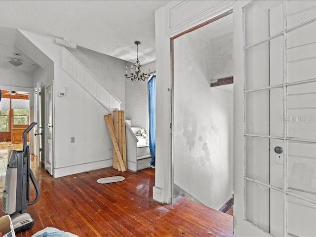 485 E Stanford St, Bartow, FL 33830 - unfurnished dining area featuring hardwood / wood-style floors, a chandelier, and baseboards