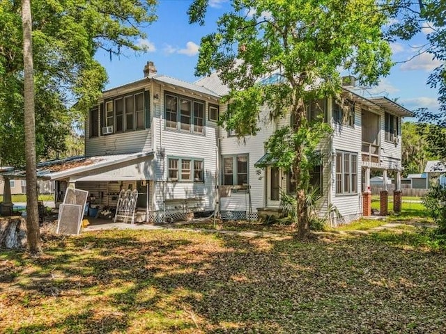 485 E Stanford St, Bartow, FL 33830 - rear view of property with a chimney