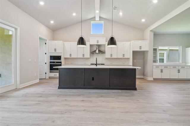 kitchen featuring ventilation hood, oven, white cabinets, built in microwave, and high vaulted ceiling