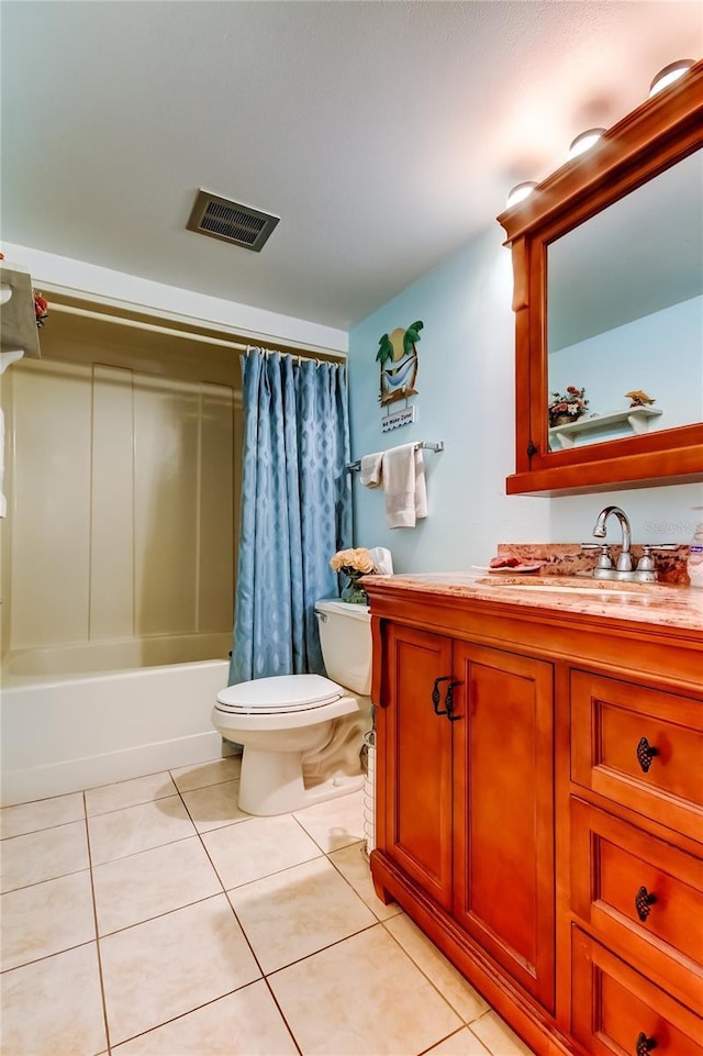 7465 Bay Island Dr S Unit 213, South Pasadena, FL 33707 - full bathroom with toilet, vanity, tile patterned floors, and shower / bath combo with shower curtain