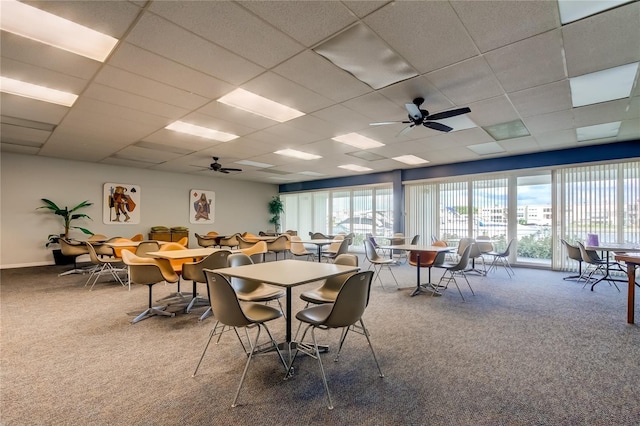 7465 Bay Island Dr S Unit 213, South Pasadena, FL 33707 - carpeted dining space featuring a drop ceiling and ceiling fan