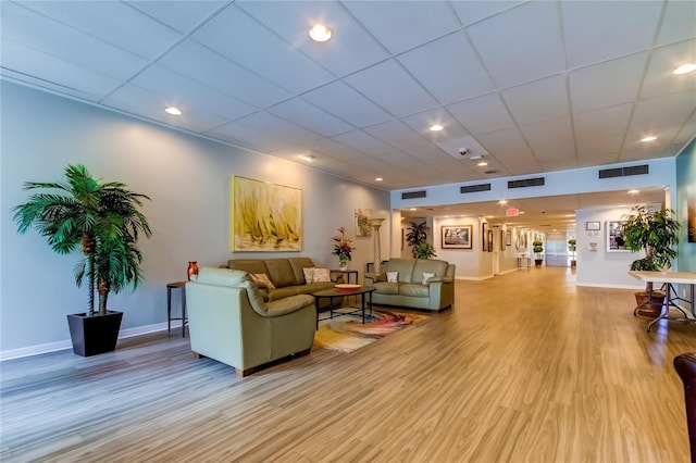 7465 Bay Island Dr S Unit 213, South Pasadena, FL 33707 - living room with light wood-style floors, baseboards, a paneled ceiling, and recessed lighting