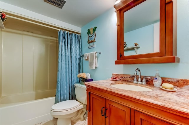 7465 Bay Island Dr S Unit 213, South Pasadena, FL 33707 - bathroom with vanity, toilet, shower / bath combo with shower curtain, and tile patterned floors