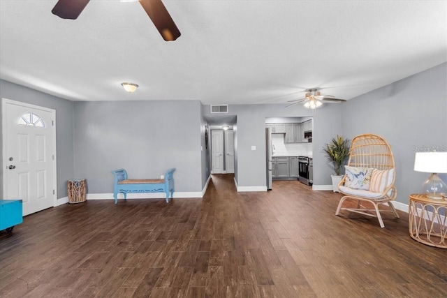 5051 Bonito Dr, New Port Richey, FL 34652 - sitting room with a ceiling fan, dark wood-type flooring, and baseboards