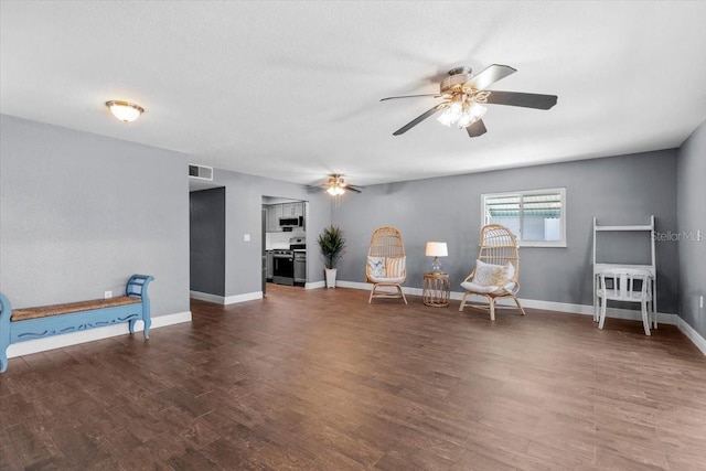5051 Bonito Dr, New Port Richey, FL 34652 - sitting room with a ceiling fan, wood finished floors, and baseboards