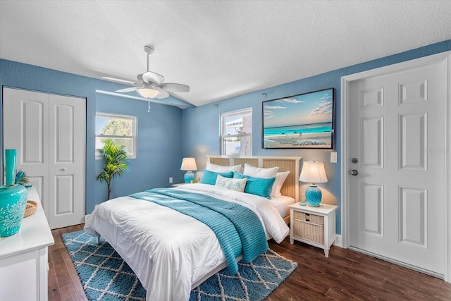 5051 Bonito Dr, New Port Richey, FL 34652 - bedroom featuring a textured ceiling, multiple windows, wood finished floors, a closet, and ceiling fan
