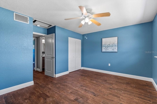 5051 Bonito Dr, New Port Richey, FL 34652 - unfurnished bedroom featuring wood finished floors, baseboards, a closet, and ceiling fan