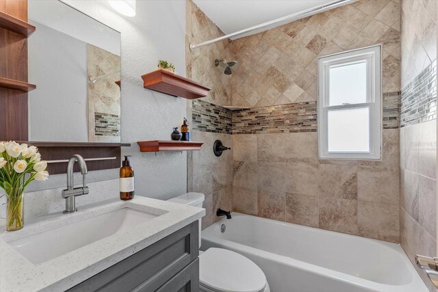 5051 Bonito Dr, New Port Richey, FL 34652 - bathroom featuring toilet, shower / washtub combination, vanity, and a textured wall