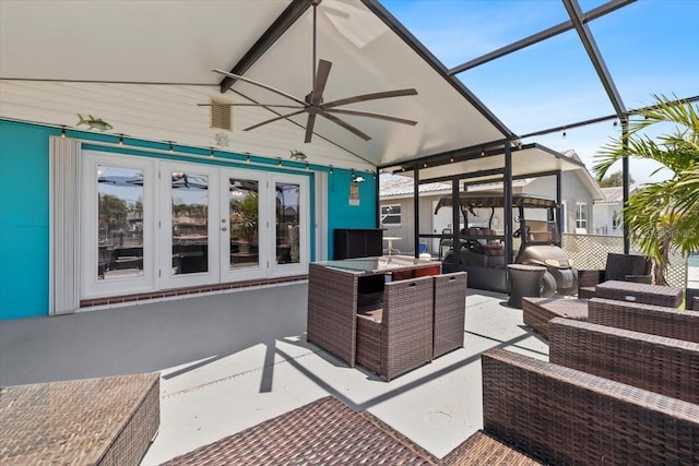 5051 Bonito Dr, New Port Richey, FL 34652 - view of patio / terrace featuring french doors, ceiling fan, an outdoor hangout area, and a lanai