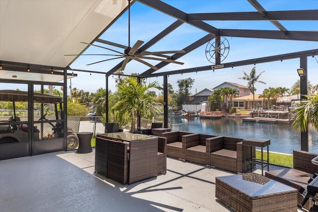 5051 Bonito Dr, New Port Richey, FL 34652 - view of patio with a water view, glass enclosure, an infinity pool, and outdoor lounge area