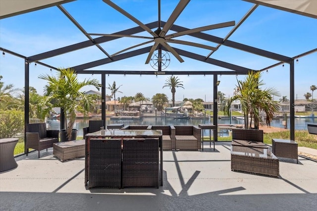5051 Bonito Dr, New Port Richey, FL 34652 - view of patio / terrace featuring an outdoor living space, a water view, and glass enclosure