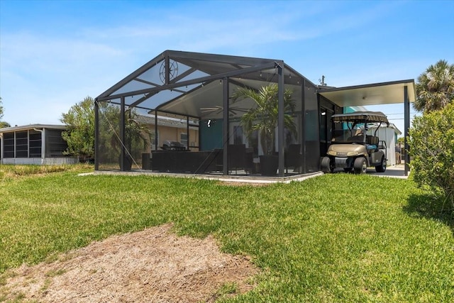 5051 Bonito Dr, New Port Richey, FL 34652 - back of house with a lawn and glass enclosure
