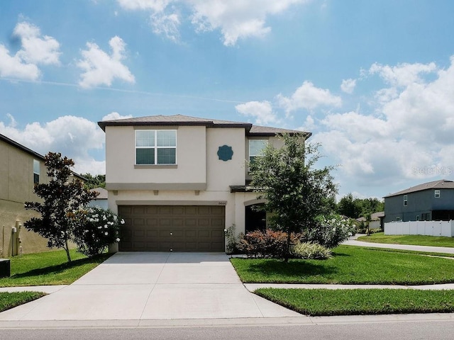 6444 Bar S Bar Trl, Zephyrhills, FL 33541 - view of front facade with stucco siding, driveway, and an attached garage