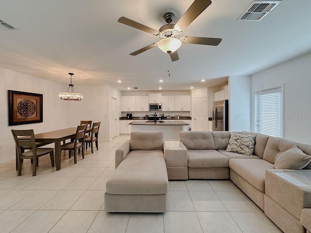 6444 Bar S Bar Trl, Zephyrhills, FL 33541 - living area featuring light tile patterned floors, recessed lighting, ceiling fan, and a chandelier