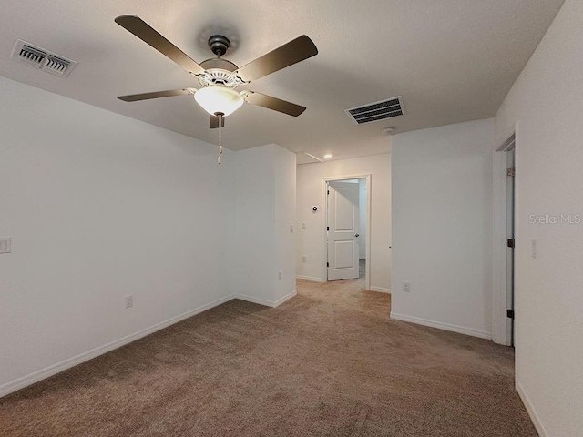 6444 Bar S Bar Trl, Zephyrhills, FL 33541 - carpeted spare room featuring a ceiling fan and baseboards