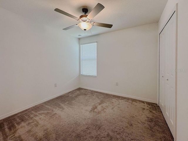 6444 Bar S Bar Trl, Zephyrhills, FL 33541 - unfurnished bedroom with carpet floors, a closet, and baseboards