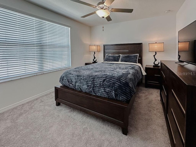 6444 Bar S Bar Trl, Zephyrhills, FL 33541 - carpeted bedroom with baseboards and a ceiling fan